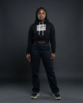 Girl wearing black cropped BAHAR "Pretty Girls Are Chosen" hoodie.