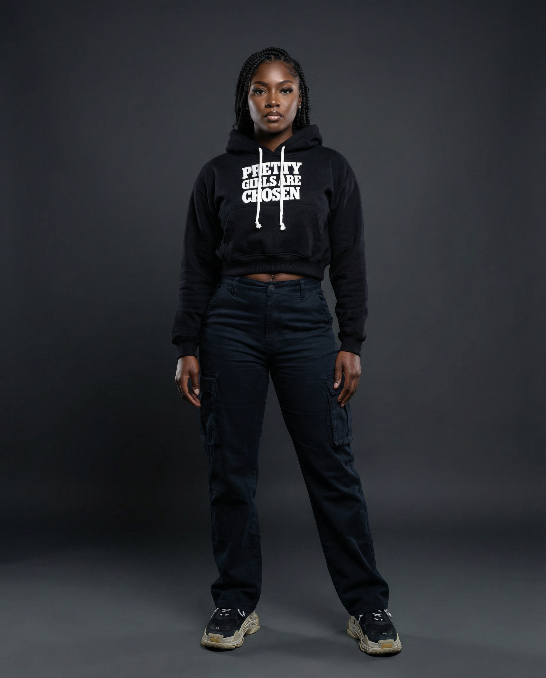 Girl wearing black cropped BAHAR "Pretty Girls Are Chosen" hoodie.