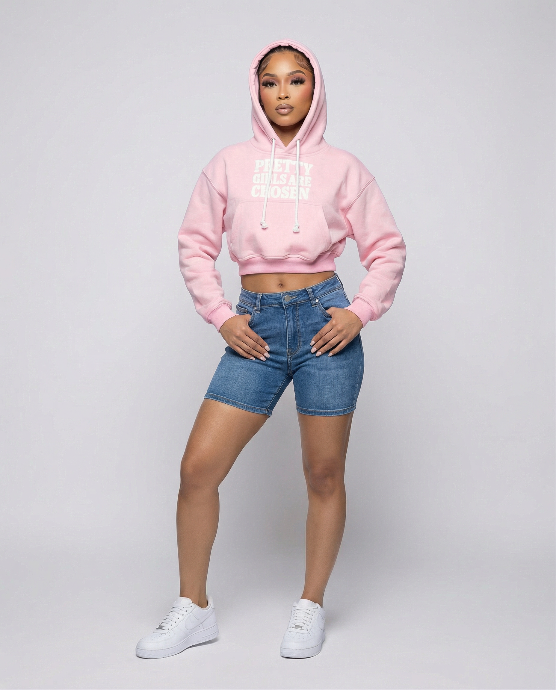 Girl wearing pink cropped BAHAR "Pretty Girls Are Chosen" hoodie.